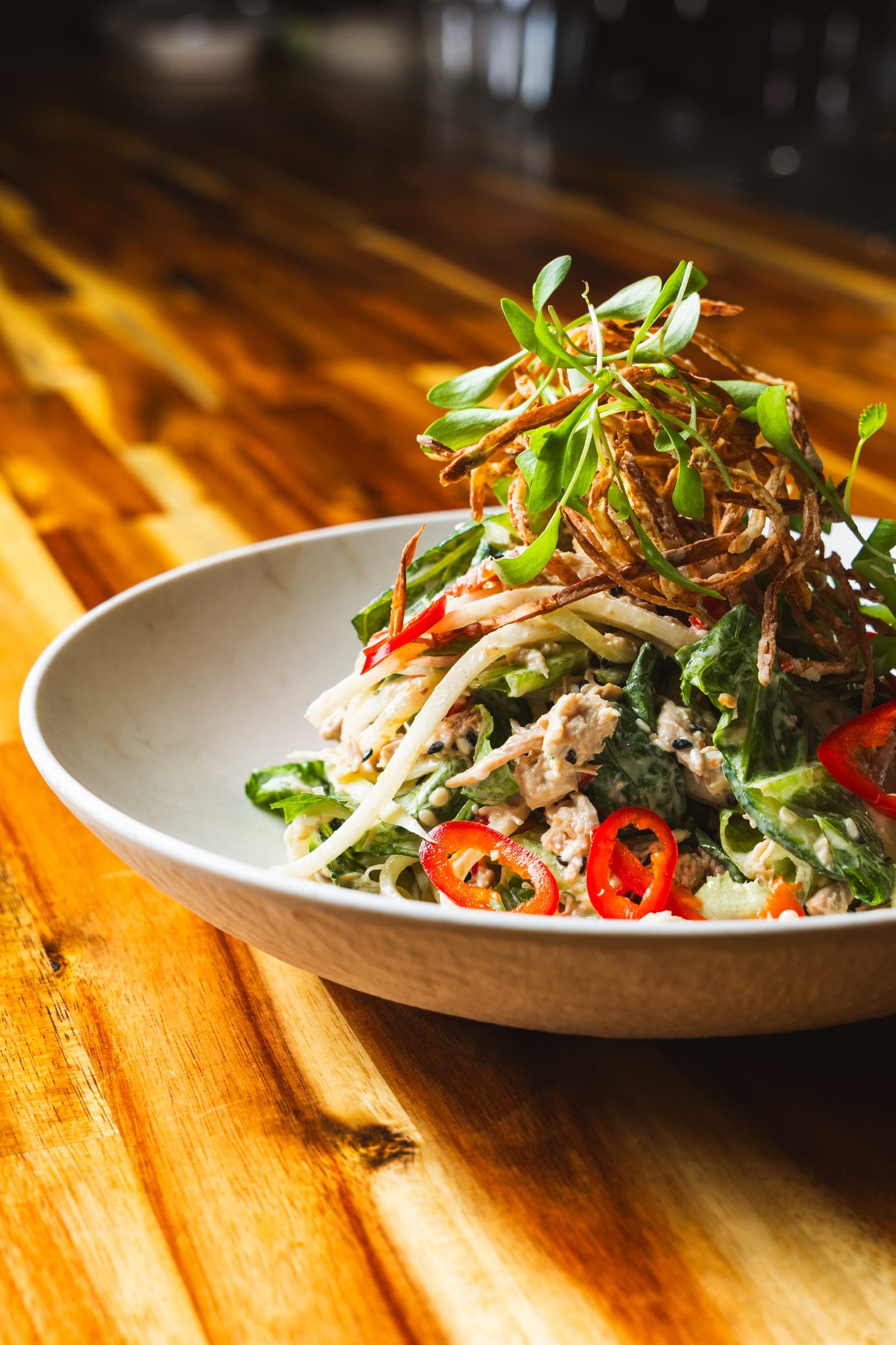 Chilled noodle salad tossed with herbs and chili