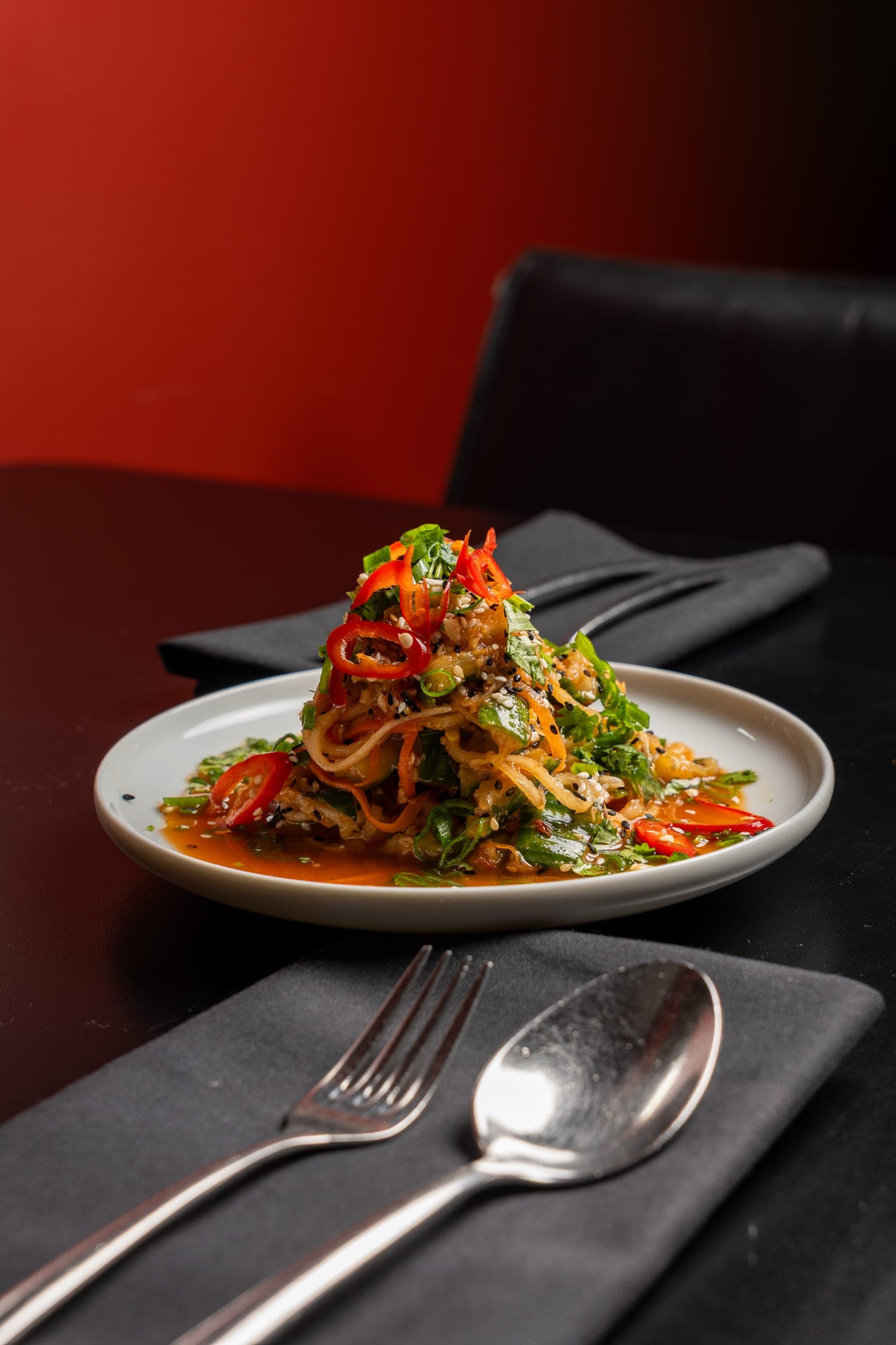 Towering tangle of noodles in an aromatic broth