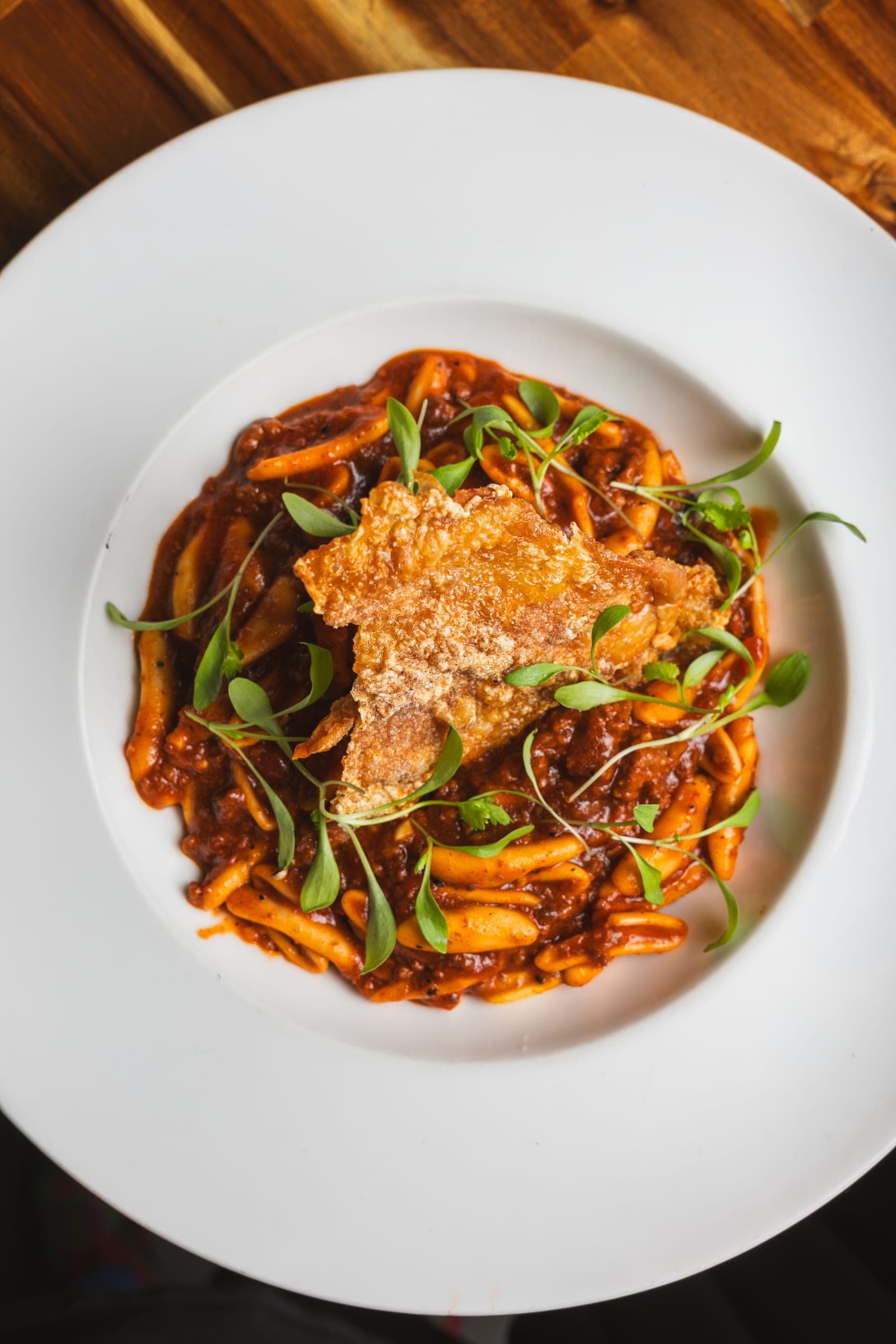 Birria-style noodles crowned with crispy cheese