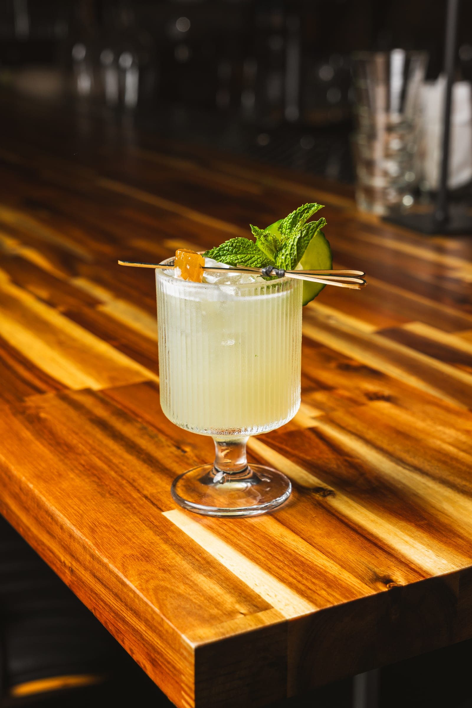 Coupe cocktail finished with fresh mint